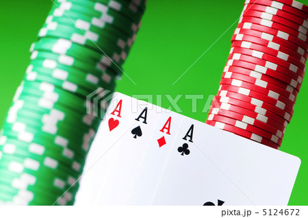 Casino chips and aces against green background 5124672