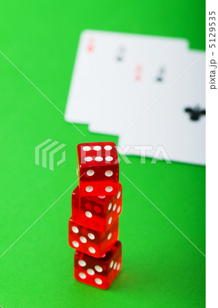 Casino chips and cards against green background 5129535