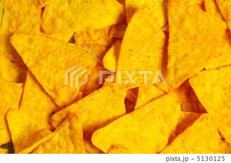 Heap of chips arranged on background 5130125