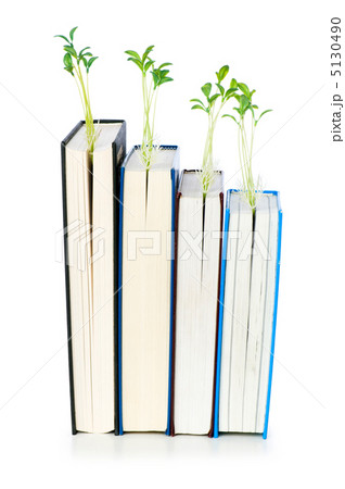 Knowledge concept with books and seedlings 5130490