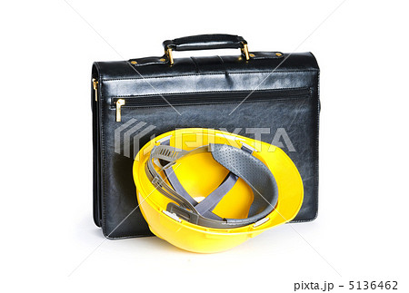 Construction concept - case and hard hat isolated on white Construction concept - case and hard hat isolated on white 5136462