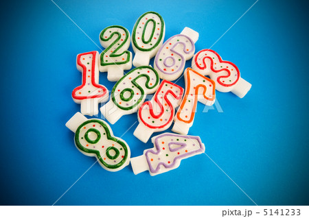 Birthday candles against colourful background 5141233