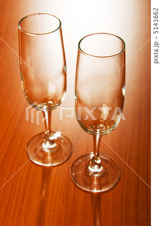 Wine glasses against wooden background Wine glasses against wooden background 5141662