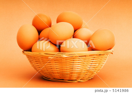 Basket of eggs on the colourful background 5141986