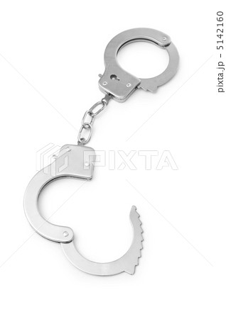 Metal handcuffs isolated on the white background Metal handcuffs isolated on the white background 5142160