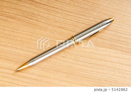 Writing silver pen on the wooden background Writing silver pen on the wooden background 5142862