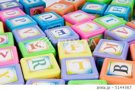 Learning and education concept - pile of alphabet blocks Learning and education concept - pile of alphabet blocks 5144367