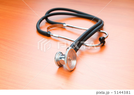 Medical concept - stethoscope on the wooden table 5144381