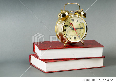 Back to school concept with books and clock 5145072