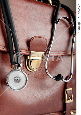 Doctor's brown leather case with the stethoscope 5145237
