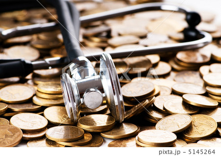 Concept of expensive healthcare with coins and stethoscope 5145264