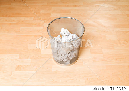 Garbage bin with paper waste isolated on white 5145359