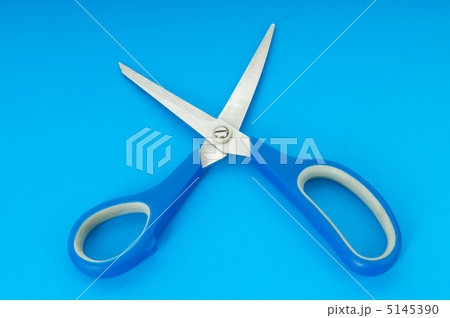 Colorful scissors on the color paper background 5145390