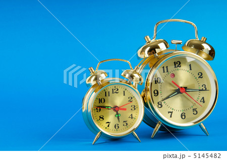 Time concept - alarm clock against colorful background Time concept - alarm clock against colorful background 5145482