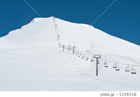 Ski lift chairs on bright winter day 5156516