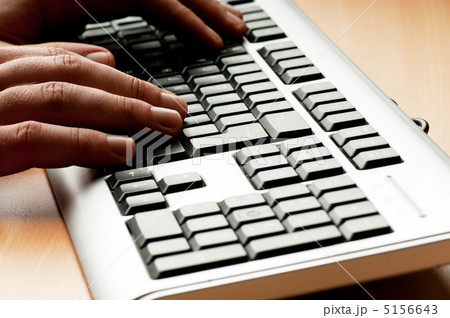 Two hands working on the silver keyboard Two hands working on the silver keyboard 5156643