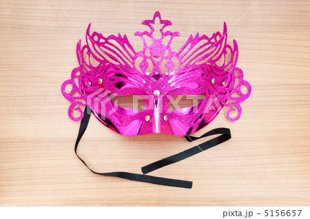 Ornate masks isolated on the wooden background Ornate masks isolated on the wooden background 5156657