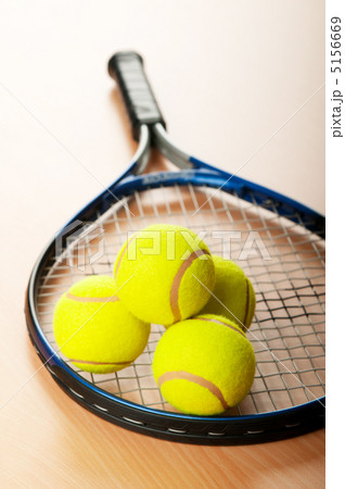 Tennis concept with balls and racket Tennis concept with balls and racket 5156669