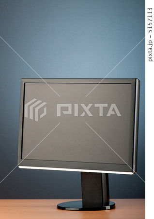 Wide screen computer monitor against colorful background Wide screen computer monitor against colorful background 5157113