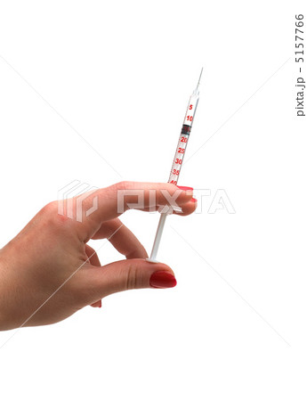 Hand holding syringe isolated on the white Hand holding syringe isolated on the white 5157766