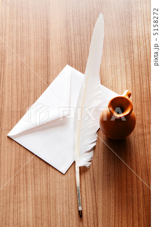 Writing feather on the background Writing feather on the background 5158272