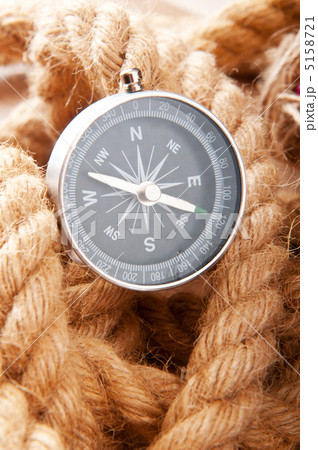 Compass and rope in travel and adventure concept Compass and rope in travel and adventure concept 5158721