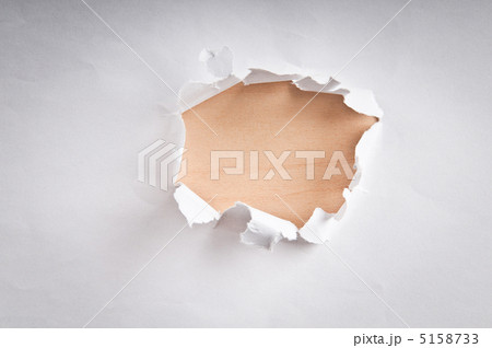 Hole in the paper with torn sides Hole in the paper with torn sides 5158733