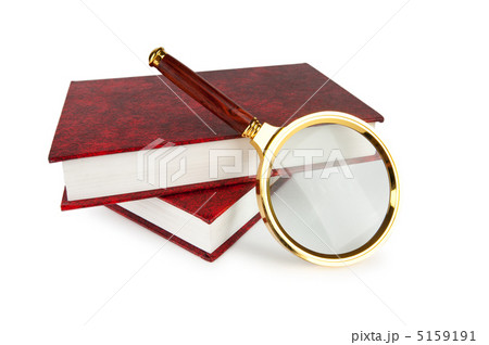 Magnifying glass over the stack of books 5159191