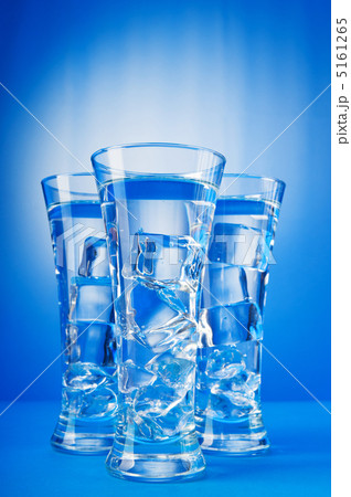 Water in the glass against gradient background 5161265