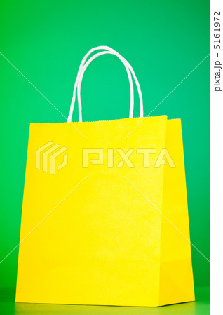 Colourful paper shopping bags against gradient background 5161972