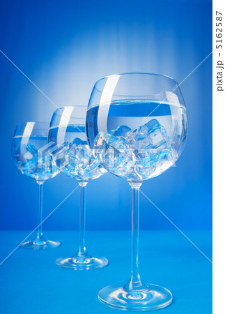 Water in the glass against gradient background Water in the glass against gradient background 5162587