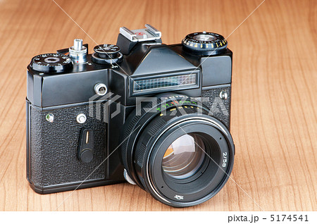 Vintage film camera against gradient background Vintage film camera against gradient background 5174541