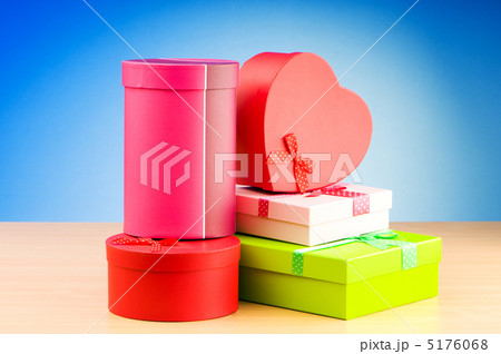 Giftboxes against gradient background 5176068