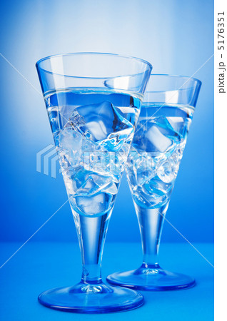 Water in the glass against gradient background Water in the glass against gradient background 5176351