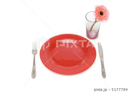 Red plate and table utensils isolated on the white Red plate and table utensils isolated on the white 5177794