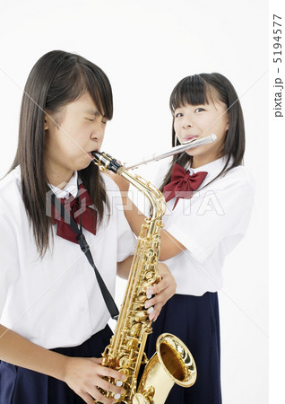 楽器を吹く女子中学生の写真素材