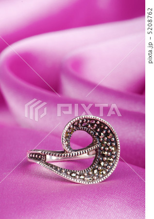 Jewellery ring on the satin background 5208762