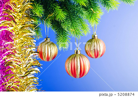 Baubles on christmas tree in celebration concept 5208874