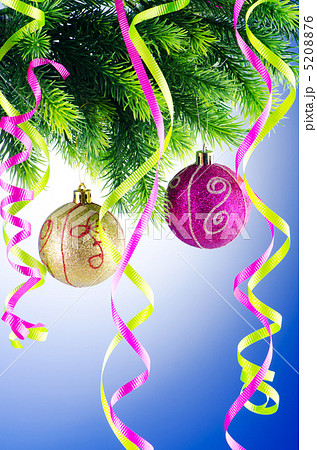 Baubles on christmas tree in celebration concept 5208876