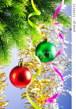 Baubles on christmas tree in celebration concept 5209313