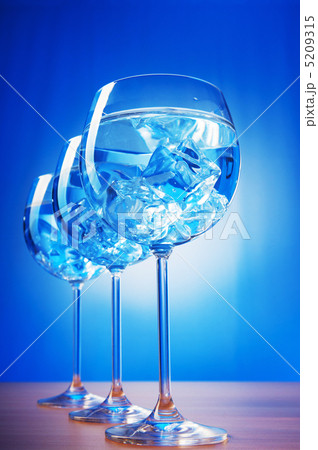 Water in the glass against gradient background Water in the glass against gradient background 5209315