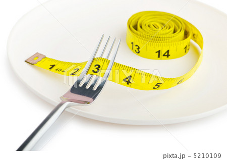 Dieting concept with fork and meter Dieting concept with fork and meter 5210109