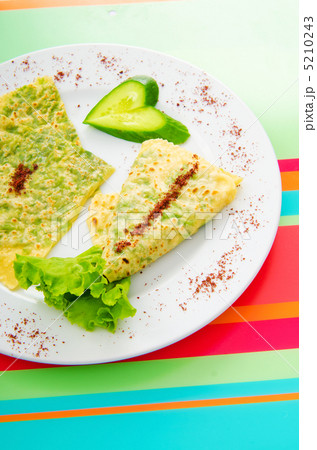 Pancake with herbs in the plate 5210243