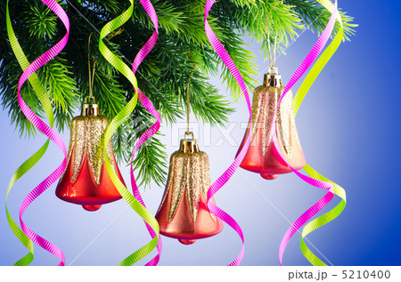 Baubles on christmas tree in celebration concept Baubles on christmas tree in celebration concept 5210400