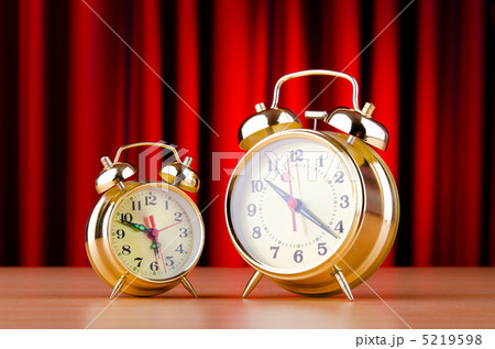 Alarm clock against curtain Alarm clock against curtain 5219598