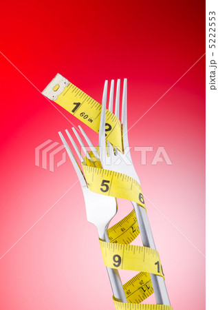 Dieting concept with fork and meter 5222553