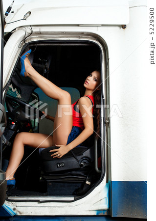 sexy young woman posing in truck cabin sexy young woman posing in truck cabin 5229500