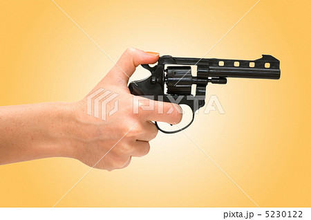 Hand holding revolver isolated on the white 5230122
