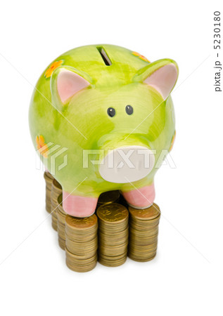 Piggy bank and coins isolated on white Piggy bank and coins isolated on white 5230180