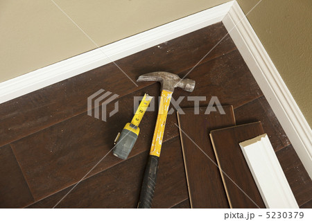 Hammer, Laminate Flooring and New Baseboard Molding 5230379